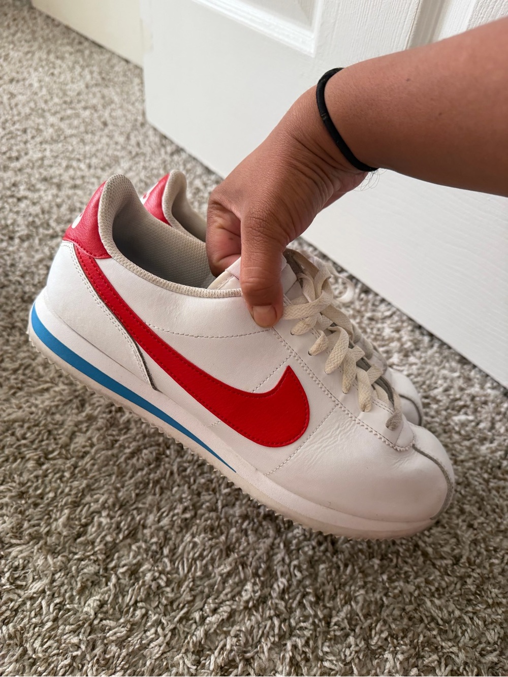Nike White Sneakers with Red Swoosh and Blue Stripe